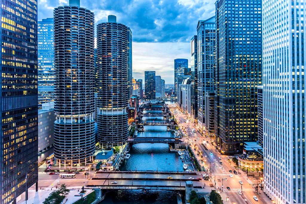 Modern city skyline with tall buildings and lights